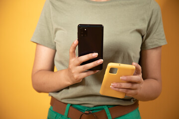 woman holds in hands mobile phone and phone case