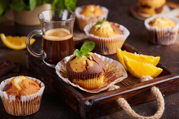 Obraz na płótnie Canvas Muffins with double flavors: orange and chocolate. Delicious homemade sweet dessert. 