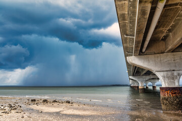 Storms passing by bridge