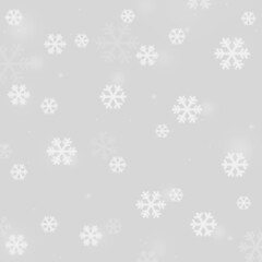 White blurred snowflake graphic pattern on a light gray silver background