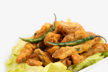 Indian Street Food Sliced Crispy Fried Potato Wedges Also Called Aloo Bhajji, Alu Bajji, Aaloo Pakoda or Pakora Made Of Bengal Gram Flour Besan Coating Are Famous Tea Time Evening Time Appetizer