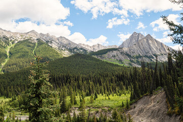 Great Rocky Mountains under magnificent clouds and sunlight, at Banff National Park, Calgary, Canada