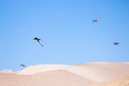 paraglider in the sky in the desert