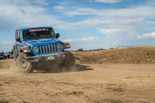Loveland, CO, USA - August 27, 2022: Jeep Wrangler, Rubicon model,  on a dusty training drive off-road course.