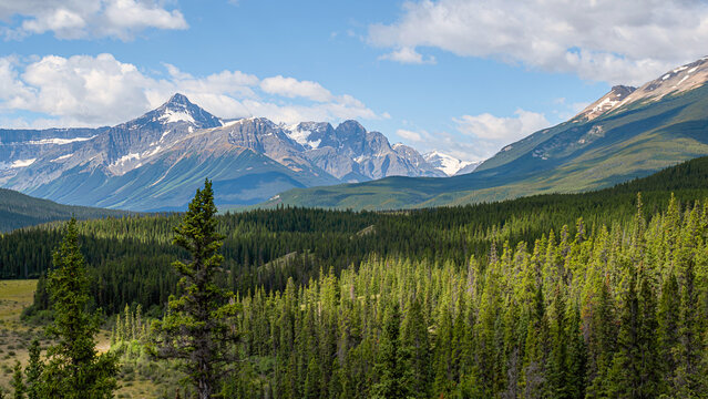 Great Rocky Mountains under magnificent clouds and sunlight, at Banff National Park, Calgary, Canada	