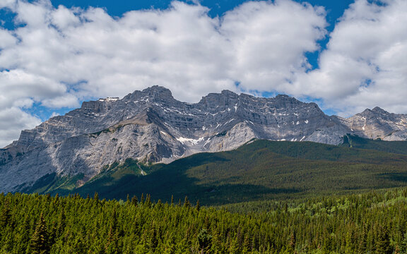 Great Rocky Mountains under magnificent clouds and sunlight, at Banff National Park, Calgary, Canada