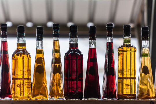 bottles with oil and vinegar at the market of pula, croatia
