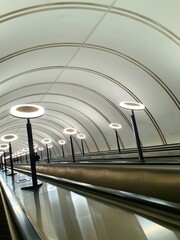 Escalator, escalator in a dark subway descent, moving steps and a depressed subway. descent to the subway, escalator