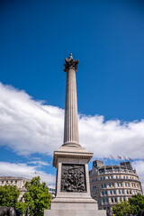 Fototapeta na wymiar Trafalgar Square and the Nelsons Column on a typical summer day.