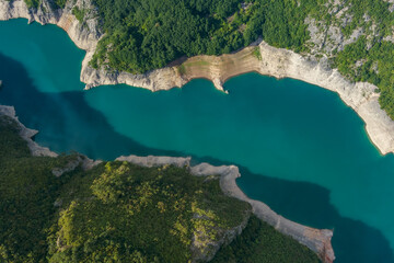 Aerial top view of Beautiful Piva river canyon with reservoir Piva Lake (Pivsko Jezero) summer view...