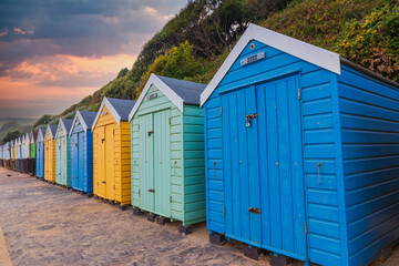 Fototapeta na wymiar Colourful wooden beach huts at Bournemouth on the South Coast of England UK Europe