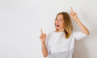 cheerful woman  promoter point index finger suggest select adverts promo over white background