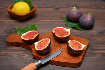 cut figs on a cutting board on the table