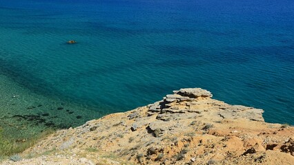 Azure blue water and bare naked coastline rock in forefront near Saint Maria beach on Pag island, northern Dalmatia, croatia, during summer season 2022