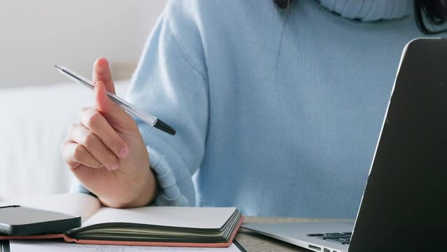 Writing reminder in notebook, planning creative idea on paper and notes in book for marketing strategy in work office. Hands of business woman doing research on laptop and journal for startup company