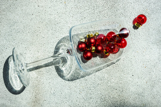 Conceptual glass of wine with red wine spilling onto the table
