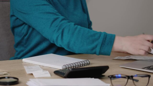 woman hands analyzing bills, checks, utility receipts, calculating expenses. bankruptcy, lack of money, financial problems concept. debts, bank unpaid overdue, overspend outcomes. financial crisis 