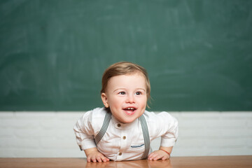 Smiling boy in classroom. School. Little cute boy is smiling. Charming boy in shirt. International childrens day. Adorable baby having fun. Carefree child. Happy childhood.