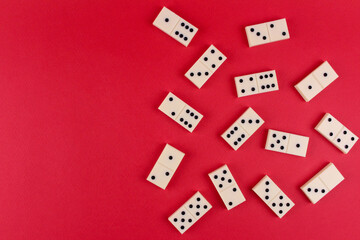 White dominoes on a red background