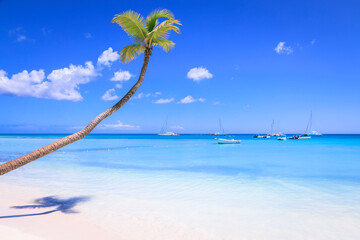 Tropical idyllic caribbean beach with sailboats, Punta Cana, Dominican Republic