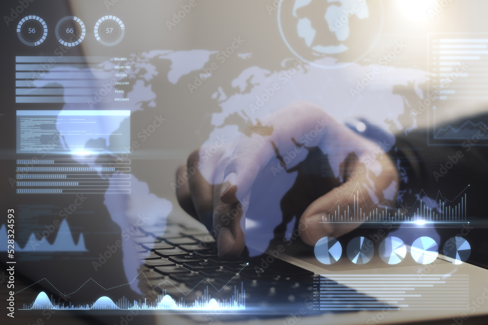 Poster Close up of businessman hand using notebook keyboard with abstract map and business chart hologram on blurry background. Investor, finance and financial dashboard concept. Double exposure.