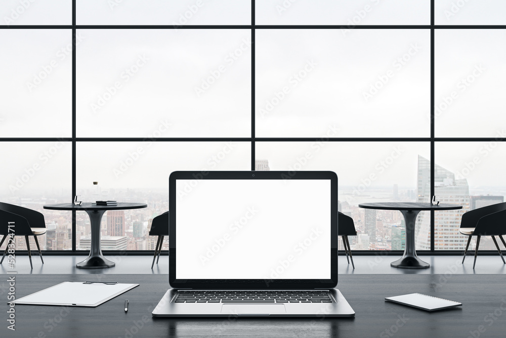Leinwandbilder close up of empty white laptop screen on gray office desktop with supplies on panoramic window and c