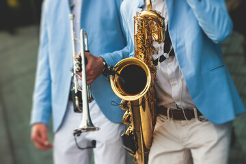 Concert view of saxophonist, a saxophone sax player with vocalist and musical band during jazz...