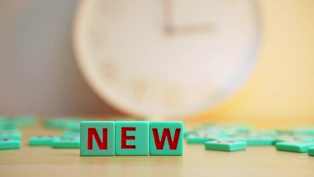 The word NEWS made of small colorful cubes with letters. . High quality 4k footage