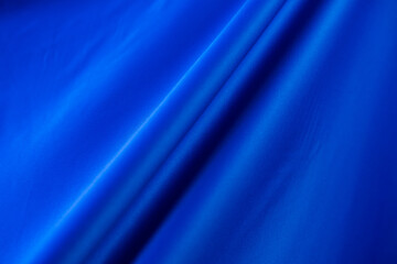 Abstract fabric background for banner. soft silk textile texture in motion for wallpaper
