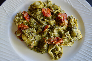Tortellini with semi sun dried tomatoes and pesto sauce