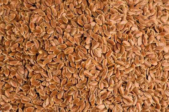 Texture and surface with flax seeds background.