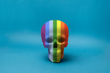 isolated human skull made of rainbow colors, symbol of halloween
