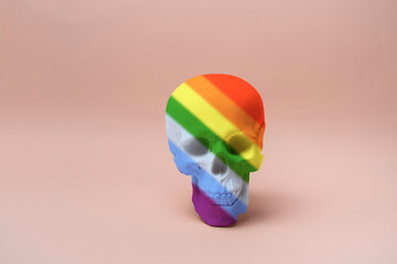 isolated human skull made of rainbow colors, symbol of halloween