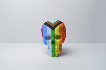 isolated human skull made of rainbow colors, symbol of halloween