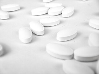 Fototapeta na wymiar white pills on white background. white medical pills.