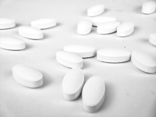 white pills on white background. white medical pills.