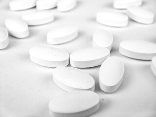Fototapeta na wymiar white pills on white background. white medical pills.
