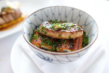 Grilled eel rice bowl with foie gras on top, unadon.