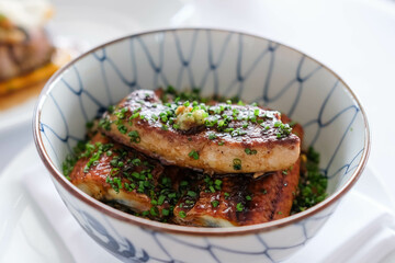 Grilled eel rice bowl with foie gras on top, unadon.