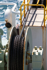 Oiled metal cable on ferry boat deck