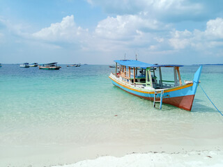 Fototapeta na wymiar Traditional boat on the beach. Tanjung Kelayang Beach, Belitung Island, Indonesia.