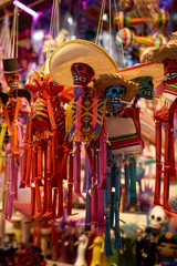 Wooden figurines of skeletons. Traditional Mexican souvenirs.