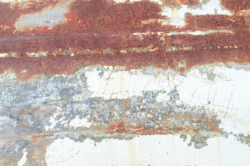 Old white autobody changing to rusted brown iron sheet for art background or texture