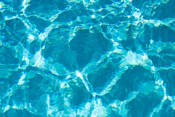 Water in swimming pool, background with high resolution. Wave abstract or rippled water texture.