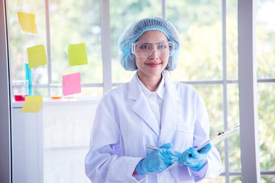 Portrait Asian Women Scientist Laboratory Background. Female Research Pathologist Clinician Expert Medical Chemist. Woman Expertise Scientist Portrait In Medical Lab. Happiness Biology Lab Woman