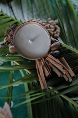 table decoration with star anise, coconut candle, nutmeg, cinnamon, corriander for traditional event