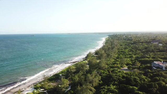 Amazing aerial panoramic of Watamu coastal tropical scenery. Sandy beach and green lush vegetation. Sunny day in Kenya