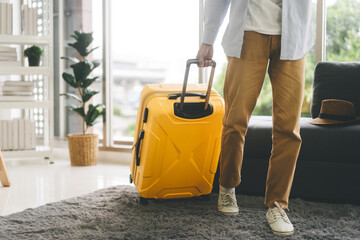 Single traveller tourism man walking carry a luggage begin a journey travel from home or hotel