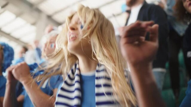 Sport Stadium Big Event: Portrait of Beautiful Sports Fan Girl with French Flag Painted Face Cheering For Her Team to Win. Crowd of Fans Shout, Celebrate Scoring a Goal, Championship Victory