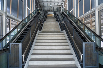 Mechanical escalator in modern subway train station at morning